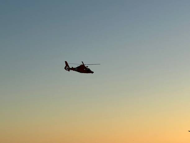 istock Coast Guard helicopter flying over Venice Beach in the sunset 1432036801