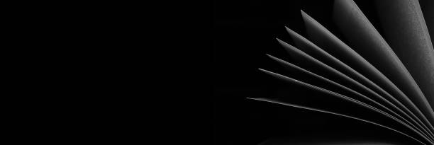 istock Open book close up, black and white, reading, education, knowledge concept. 1432038029