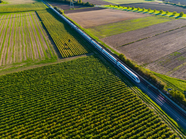 Aerial view of a modern InterCityExpress train between fields in the countryside