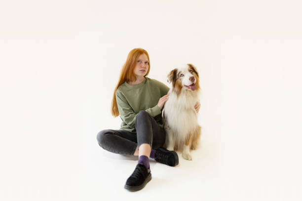istock Red haired young Woman and Australian Shepherd  Dog 1432047549