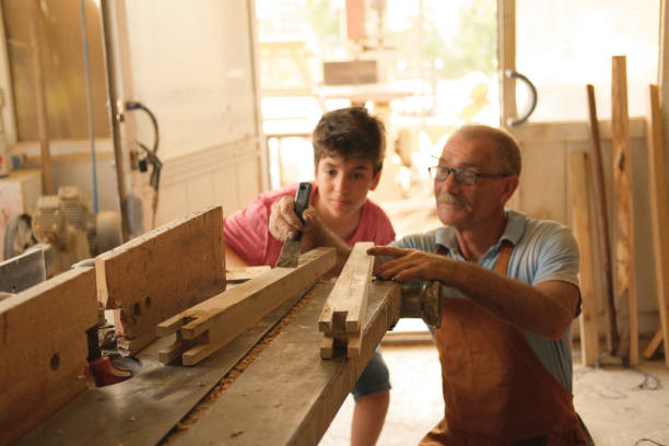 istock master-apprentice relationship to the furniture workshop 1432047740