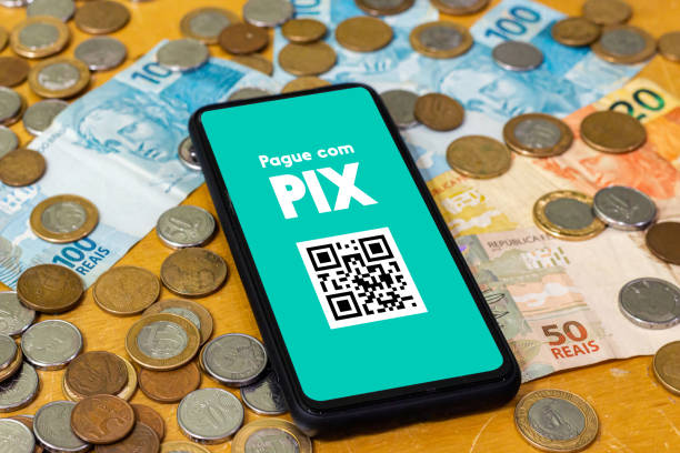 istock Pix on smartphone screen with multiple coins around. Pix is the new payment and transfer system of the Brazilian and Brazilian government. 1432050908