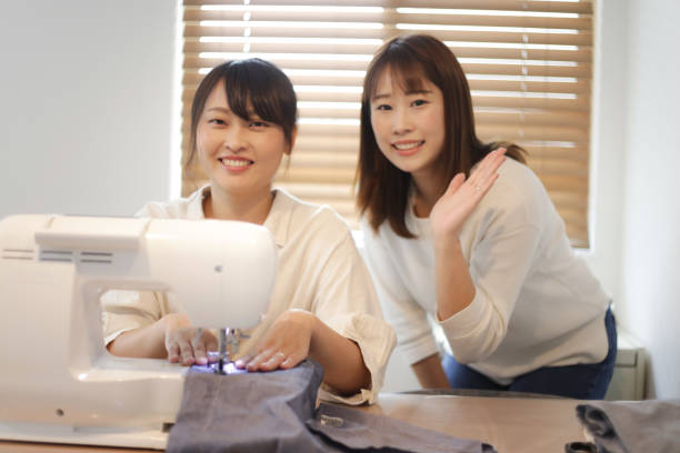 istock A woman learning how to use a sewing machine 1432054819