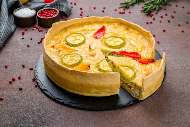 istock Vegetable quiche with antipasti and vegetables on brown table 1432058714
