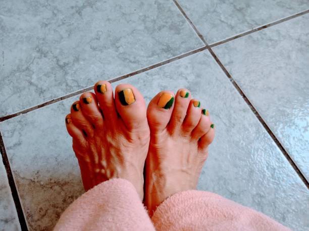 Ordinary Female Feet With Painted Nails. Fetish Stock Photo