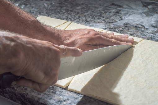 Baker making croissant before going to the oven,bakery concept with coppy space.