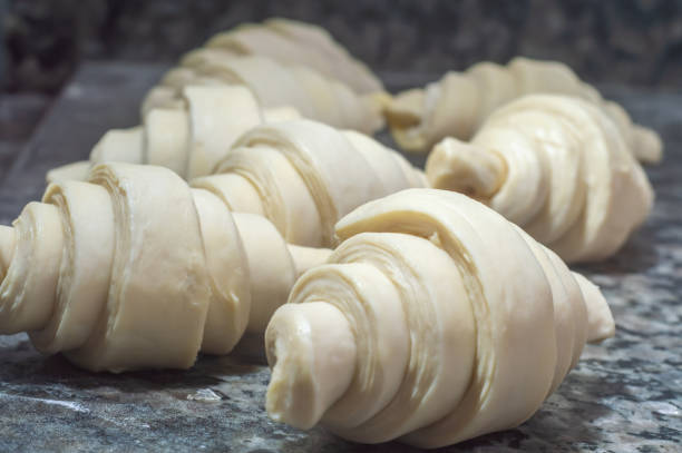 istock Baker making croissant before going to the oven,bakery concept with coppy space 1432063198