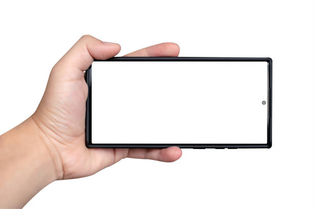 istock Male hand holding smartphone with blank screen isolated on white background. 1432084215