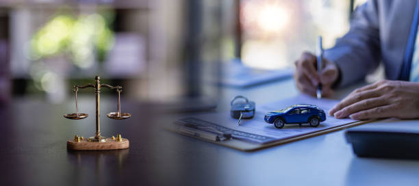 car auction concept and car keys on a wooden table with golden scales concept of selling a car by auction or law ah fair stock photo