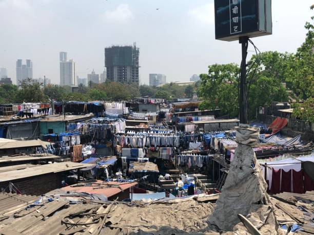 istock Slum area in India with clothes rack 1432085702