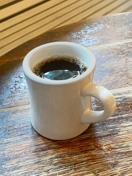 istock Cup of coffee in a diner table 1432092473