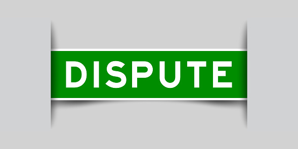 Inserted green color label sticker with word dispute aon gray background