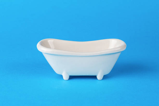 istock White wash tub on a blue background. Minimal concept. 1432096346