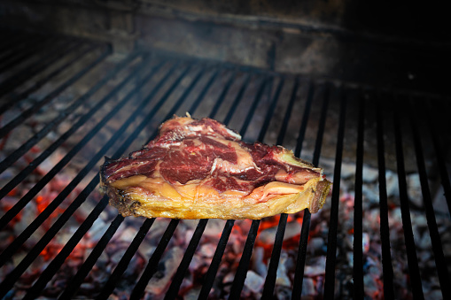 Spanish beef steak Chuleton on charcoal grill