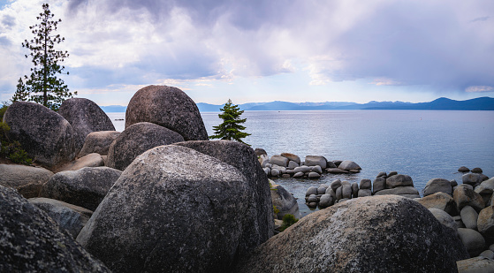 Tranquil Lake Tahoe with glacial rocks and boulders in Sand Harbor in Nevada