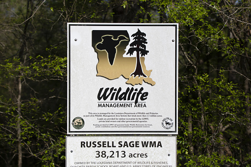 RUSSELL SAGE WILDLIFE MANAGEMENT AREA, MONROE, LOUISIANA/USA  APRIL 03 2021: Louisiana Department of Wildlife and Fisheries sign marking the entrance to the Russell Sage Wildlife Management Area near Monroe, Louisiana.