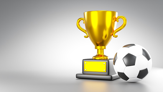Gold trophy cup and soccer ball or football on gray background with copy space . 3D rendering .
