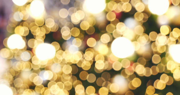 istock Blurred background golden glitter shiny sparkling banner. Happy Holidays background for template on christmas card brochures posters. Gold bokeh template for digital presentation slideshow background 1432108282