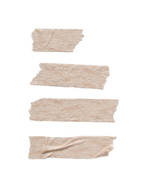 beige paper masking tape in various length - adhesive tape imagens e fotografias de stock