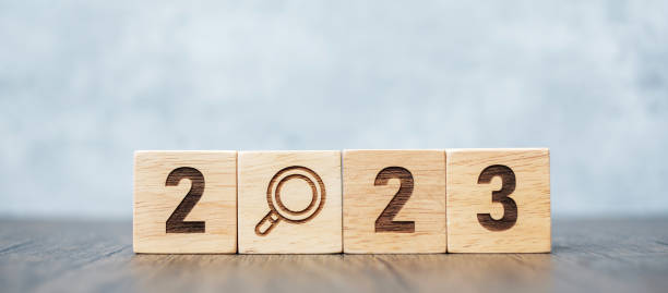 istock 2023 block with magnifying glass icon. SEO, Search Engine Optimization, hiring , Advertising, Idea, Strategy, marketing, Keyword, Content and New Year start concepts 1432112803