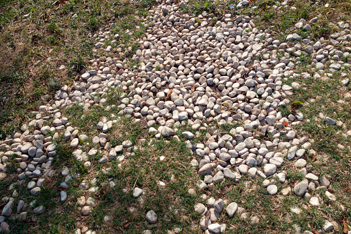 Dry river bed with stones in the winter