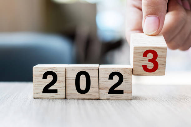 istock hand flipping block 2022 to 2023 text on table. Resolution, strategy, plan, goal, motivation, reboot, business and New Year holiday concepts 1432113111
