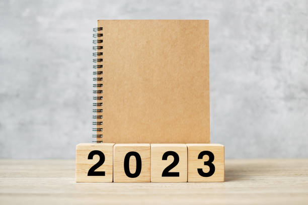 istock 2023 Happy New Year with blank notebook and wooden number. countdown, Resolution, Goals, Plan, Action and Mission Concept 1432113294