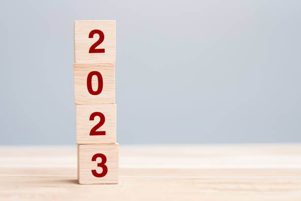 istock wooden cube block with 2023 text on table background. Resolution, plan, review, goal, start and New Year holiday concepts 1432113346