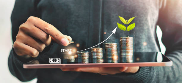 istock Startup concept with icon business and network connection with people putting coins stack  and plant growth on money 1432115011
