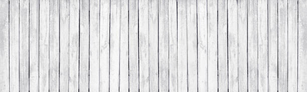 istock White painted old wooden rustic fence. Whitewashed rough wood board large texture. Light grunge background 1432117661