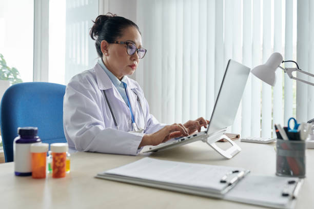 istock Female doctor working on laptop at office 1432119644