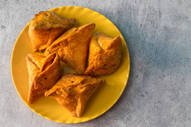 istock popular Indian snack Samosa is ready to eat. 1432119900