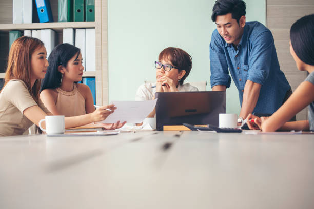 istock Creative design office center working teamwork. Happy business people partner plan strategy organization research people together at diversity office using laptop, smartphone company conference room 1432121044