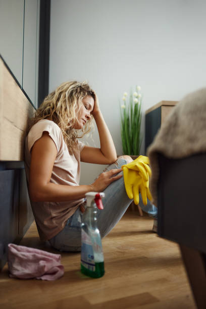 istock Exhausted maid taking a break from chores. 1432124639