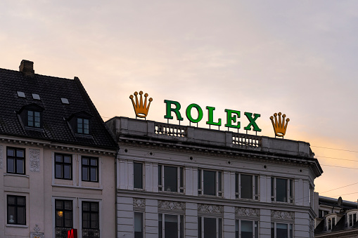 Copenhagen, Denmark. October 2022. the luminous sign of the Rolex brand on the roof of a building in the city center