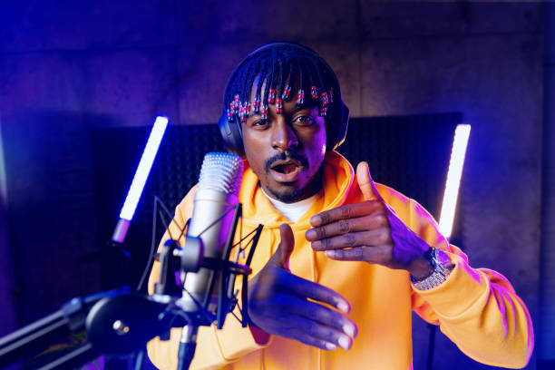 istock Young African performer recording his new track in recording studio 1432131298