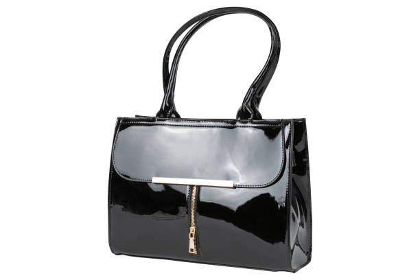 istock Black lacquer women's bag with a zipper and long handles, on a white background 1432131365