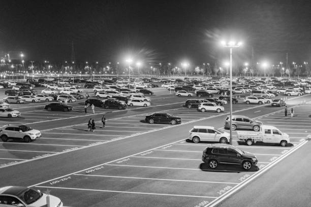 huge open-air parking lot - street light parking lot night lot imagens e fotografias de stock
