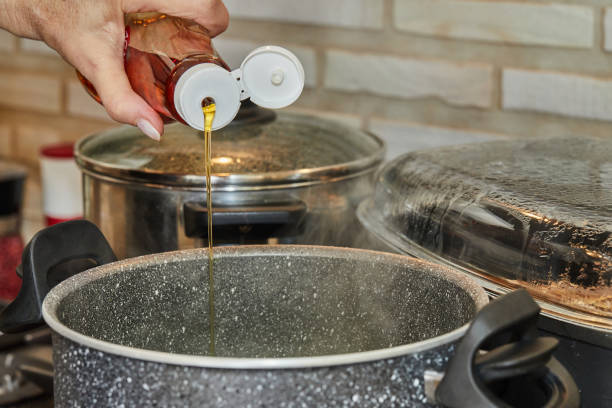 istock Pours maple syrup into the pot with the dish being prepared 1432132456