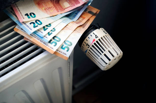 Radiator control and Euro bills stock photo