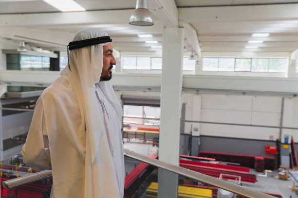 istock Middle Eastern Businessman Looking at Factory Floor 1432135375
