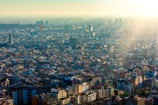 istock Barcelona Skyline with sun 1432136760
