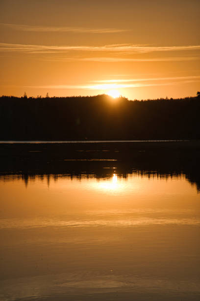 istock Sunset with reflection on a Swedish lake in Smalland. Romantic evening mood 1432137684