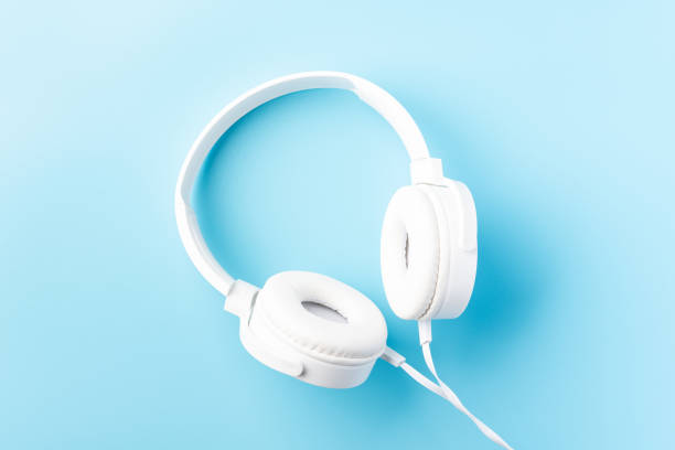 istock White headphones on light blue background 1432143446