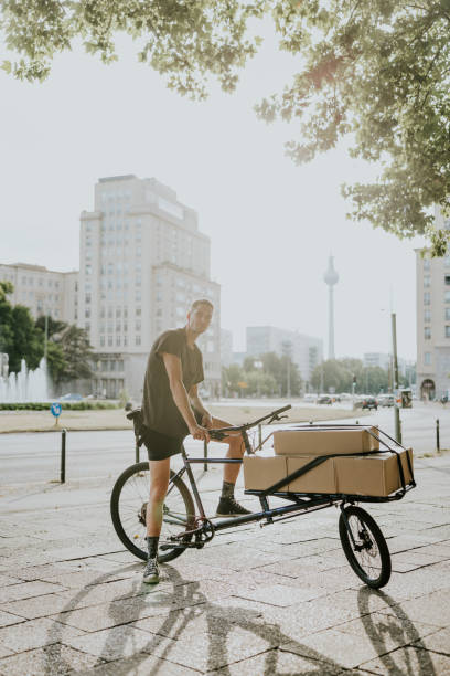 istock Positive bike messenger on cargo bike 1432146268