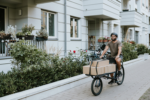 Photo series of a gay couple living sustainable lifestyle and using cargo bike for transportation in Friedrichshain neighbourhood Berlin.