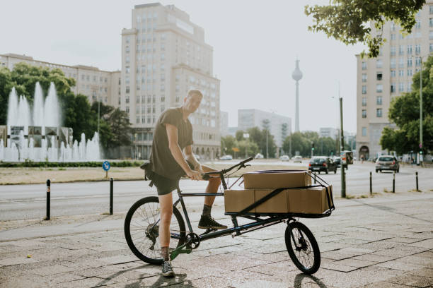 istock Positive bike messenger on cargo bike 1432146308