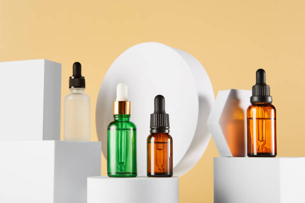 istock Dropper vials with serum are on white geometric shapes. 1432149243