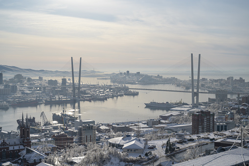Vladivostok, Russia - November 21, 2020: Vladivostok cityscape - view of the snow-covered city.