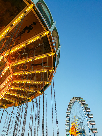 Swing carousel and Ferris wheel in Munich, Germany